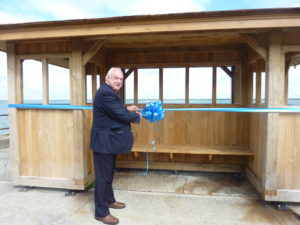 Photograph shows former Mayor of Cowes, Geoff Banks BEM unveiling the seafront shelter
