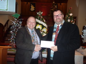 Photograph of the Mayor of Cowes presenting a donation to the Earl Mountbatten Hospice